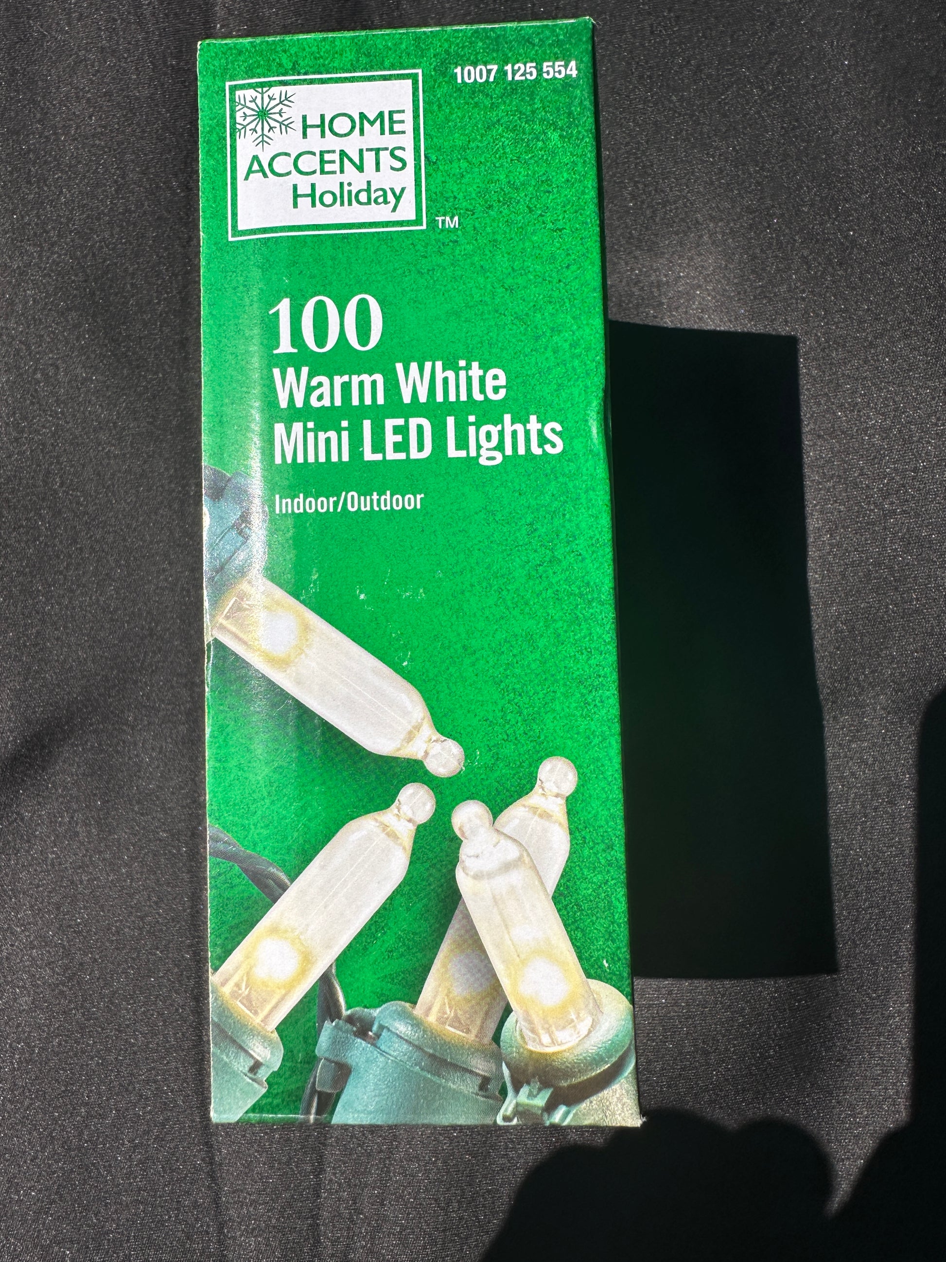 Side view of the Home Accents Holiday warm white LED mini Christmas lights packaging.